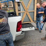 Missouri Furnace & Air Conditioning unloading a boiler.