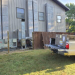 A commercial rooftop AC unit being installed by Missouri Furnace & Air Conditioning.