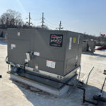 Ruud commercial AC rooftop installation by Missouri Furnace & Air Conditioning.